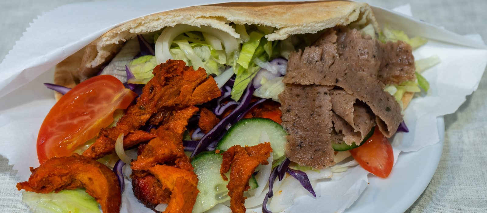 Mixed doner and chicken kebab in pitta with salad